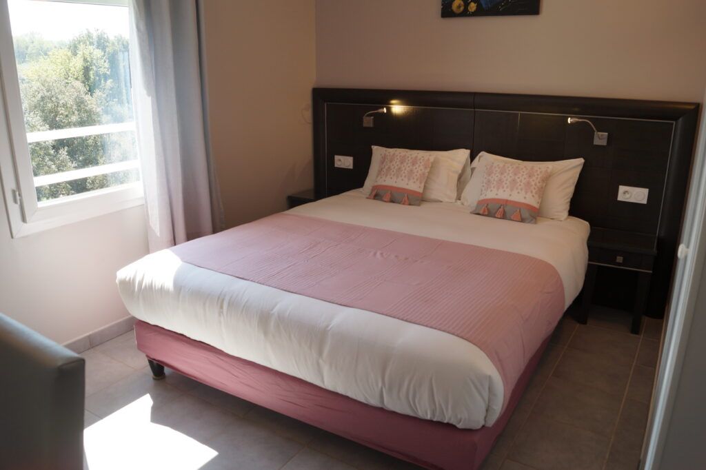 bright bedroom with double bed